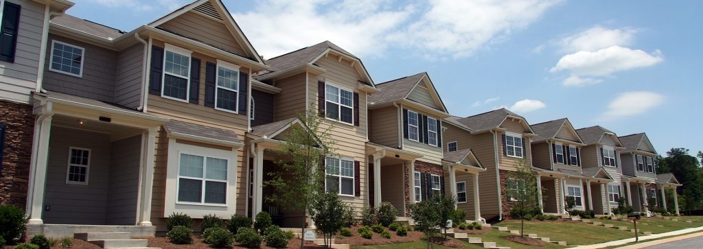 Landlord Rental Property Hero row of townhouses in suburban neighborhood